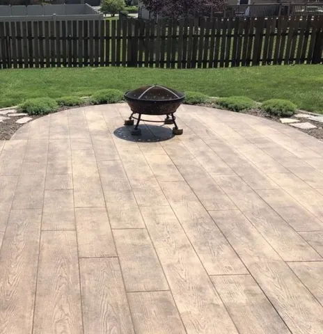 a view of a backyard with wooden fence