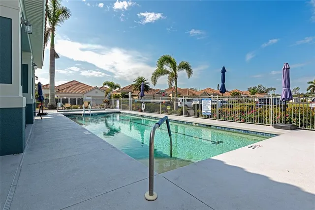 a view of a swimming pool with a lake view