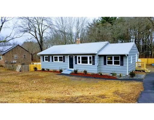 a aerial view of a house with swimming pool and a yard