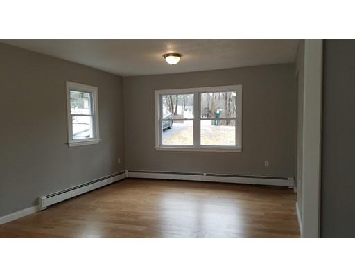 454 Middlesex Turnpike Billerica, MA 01821 - Photo 11 of 15 a black and white photo of a living room