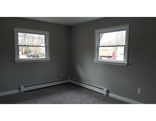 454 Middlesex Turnpike Billerica, MA 01821 - Photo 12 of 15 a black and white photo of a living room