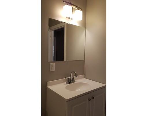 454 Middlesex Turnpike Billerica, MA 01821 - Photo 4 of 15 a bathroom with a sink and a mirror