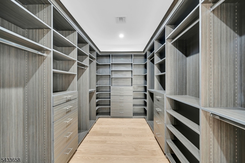 2 Orchard Road Florham Park, NJ 07932 - Photo 20 of 23 a view of walk in closet with clothes and shoes