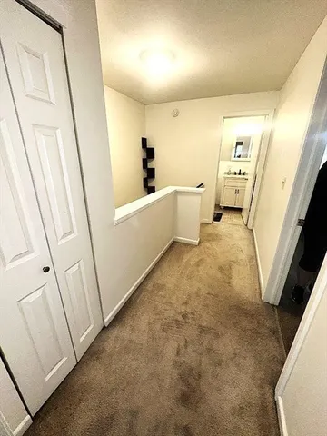 a bedroom with a bed and a mirror