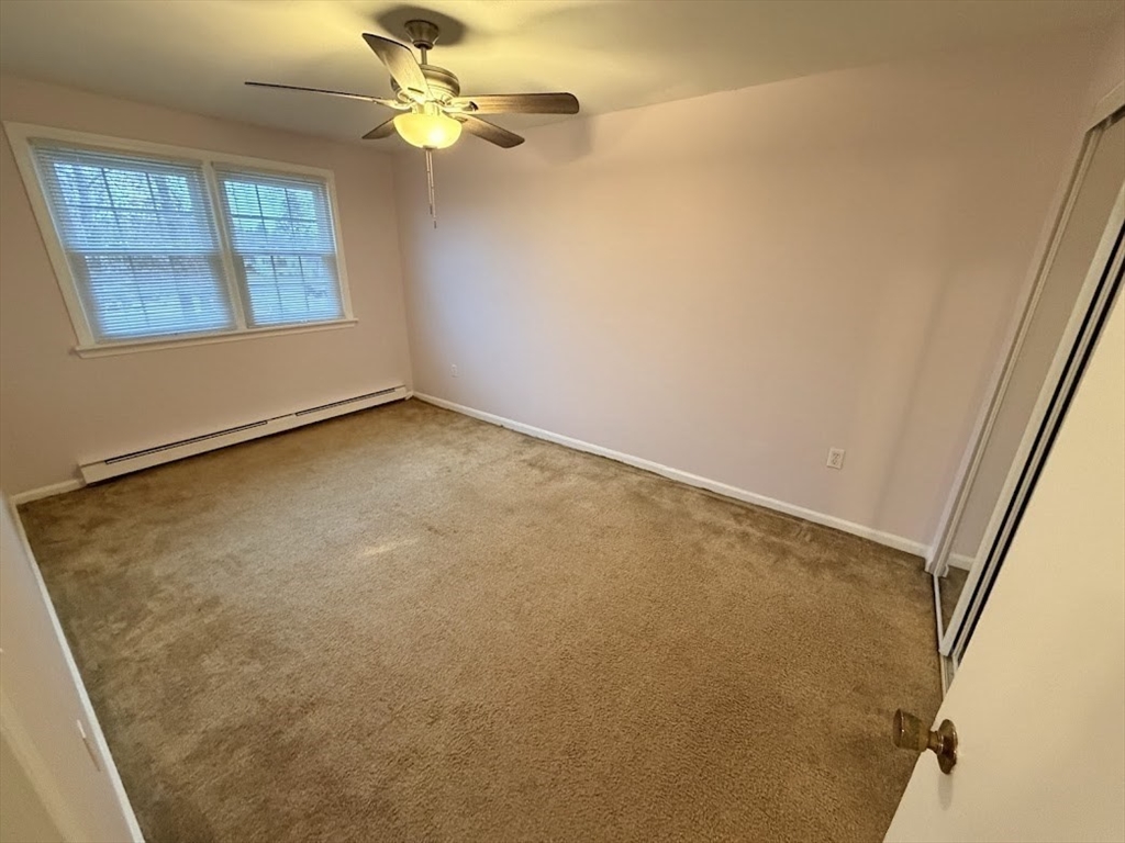 540 Granby Road, Unit 62 South Hadley, MA 01075 - Photo 17 of 20 an empty room with a window