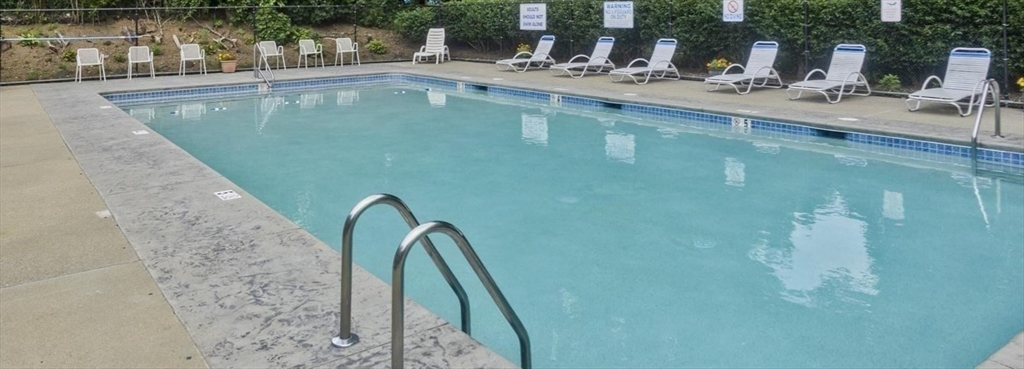 540 Granby Road, Unit 62 South Hadley, MA 01075 - Photo 19 of 20 a view of a swimming pool with a chair
