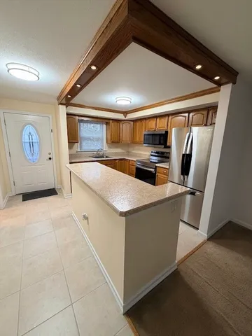a view of bathroom with a toilet sink and mirror
