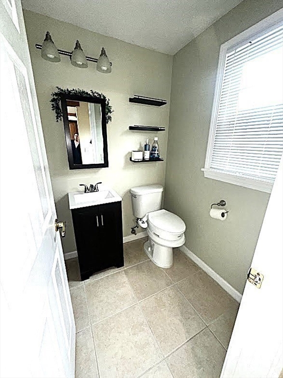 540 Granby Road, Unit 62 South Hadley, MA 01075 - Photo 6 of 20 a view of bathroom with a toilet sink and mirror