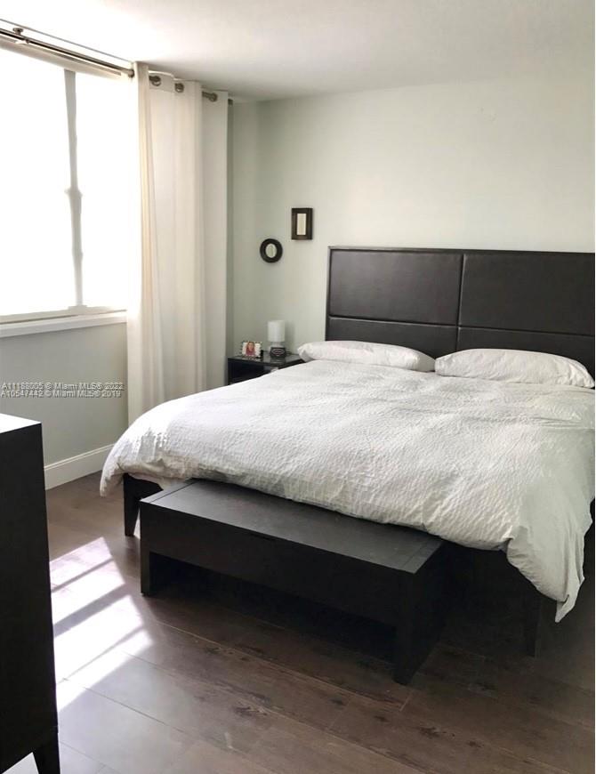 9511 Collins Avenue, Unit 308 Surfside, FL 33154 - Photo 12 of 14 a bedroom with a bed and a window