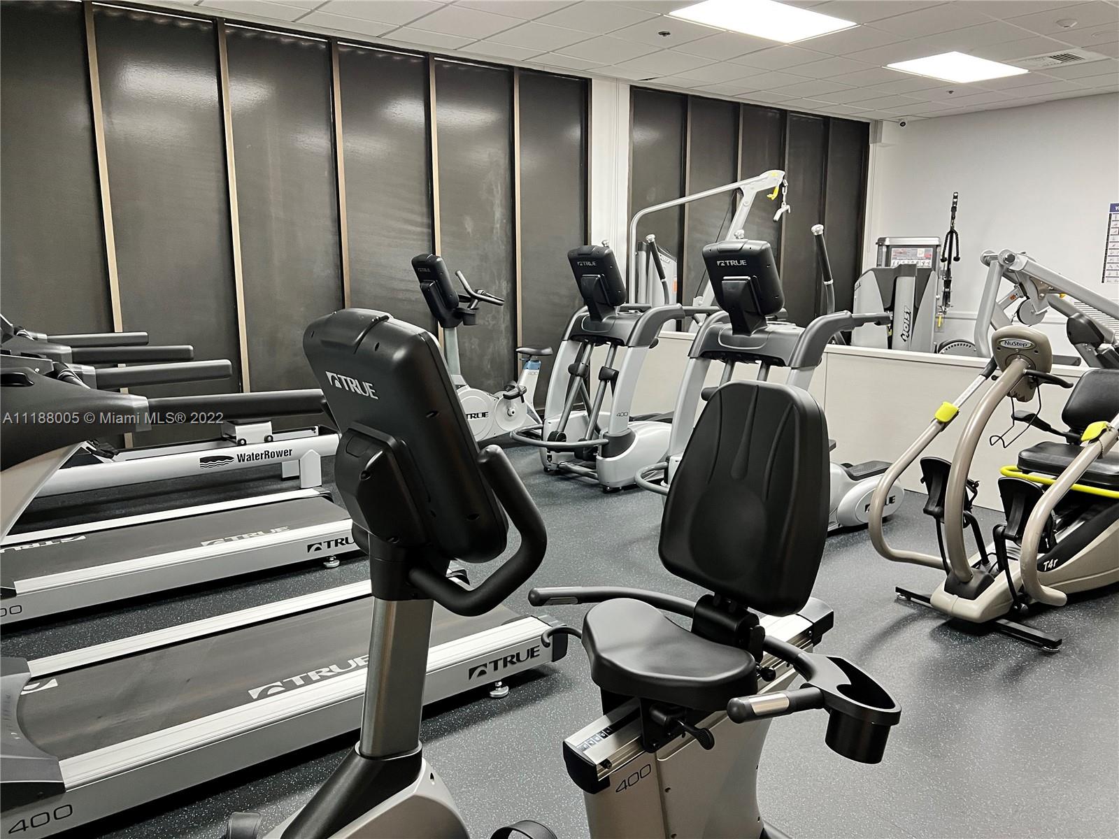 9511 Collins Avenue, Unit 308 Surfside, FL 33154 - Photo 5 of 14 a view of a room with gym equipment