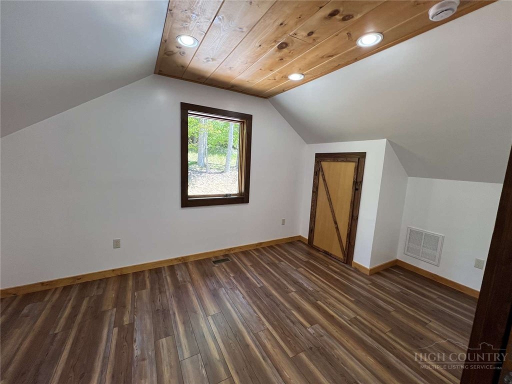 138 Talon Drive Boone, NC 28607 - Photo 17 of 25 a view of an empty room with wooden floor and a window