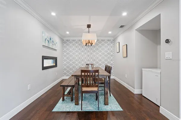 a view of a dining room with furniture and wooden floor