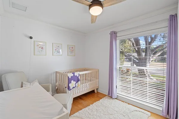 a bedroom with furniture and a window