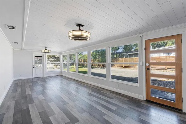 a view of an empty room with a window