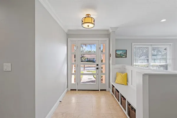 a view of an entryway with wooden floor and a window