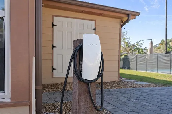 a view of a porch with a table and a chair