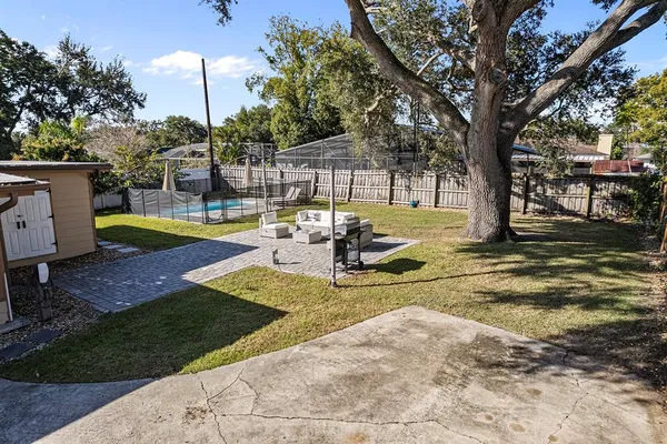 a view of a swimming pool with a patio
