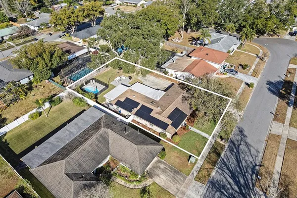 an aerial view of a house with a garden