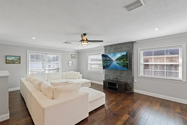 a living room with furniture and a fireplace