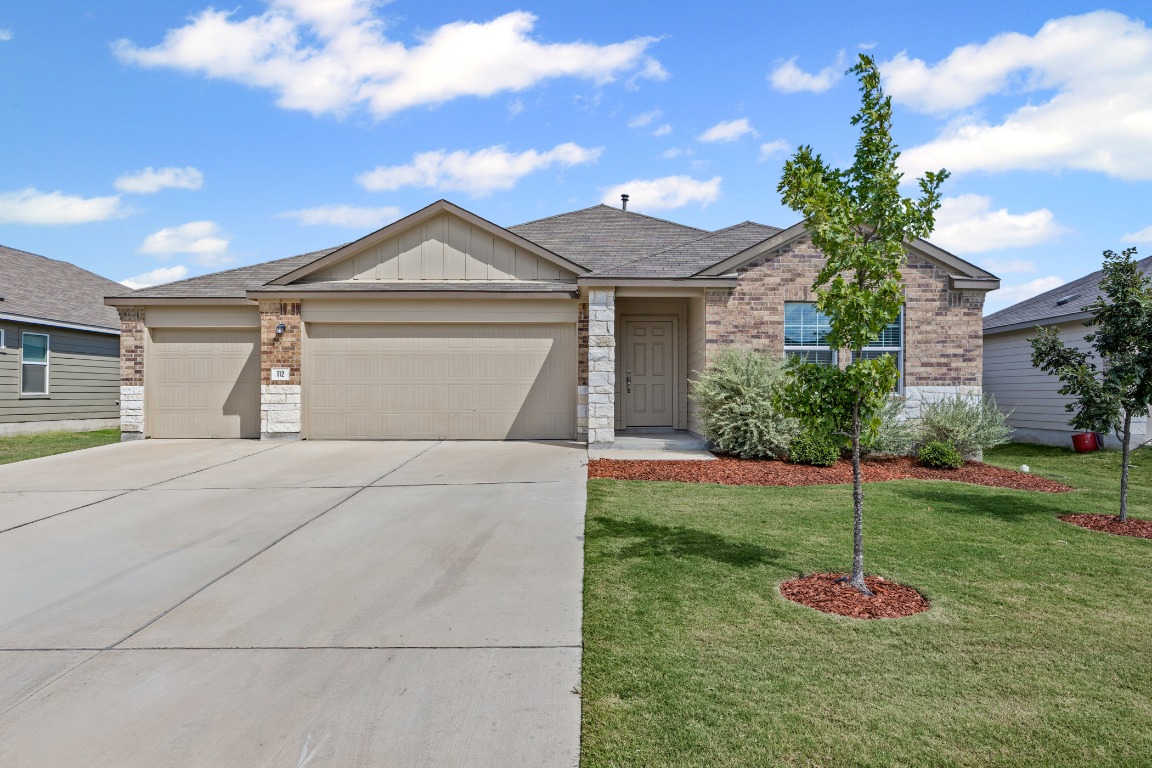 Single story house featuring 3-car garage and six car driveway.