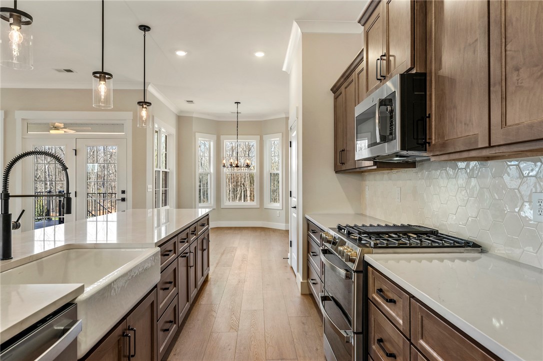 103 Wagner Court Easley, SC 29642 - Photo 12 of 36 This spacious culinary haven offers abundant light and seamless outdoor access.