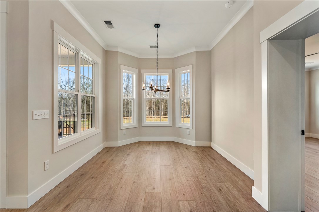 103 Wagner Court Easley, SC 29642 - Photo 13 of 36 This bright dining area features ample natural light and a charming chandelier, perfect for memorable gatherings.