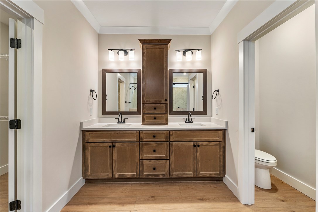 103 Wagner Court Easley, SC 29642 - Photo 18 of 36 This primary bathroom offers dual vanities with ample storage and sleek fixtures.