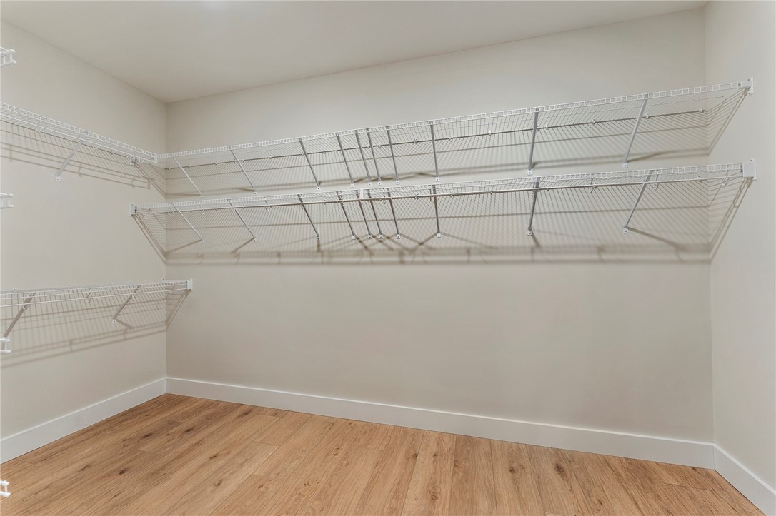 103 Wagner Court Easley, SC 29642 - Photo 22 of 36 This spacious closet offers ample storage with durable wire shelving and warm wood flooring.