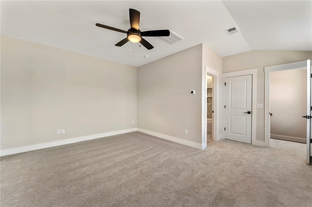 103 Wagner Court Easley, SC 29642 - Photo 30 of 36 This expansive room offers comfort and potential, featuring soft carpeting and a ceiling fan.