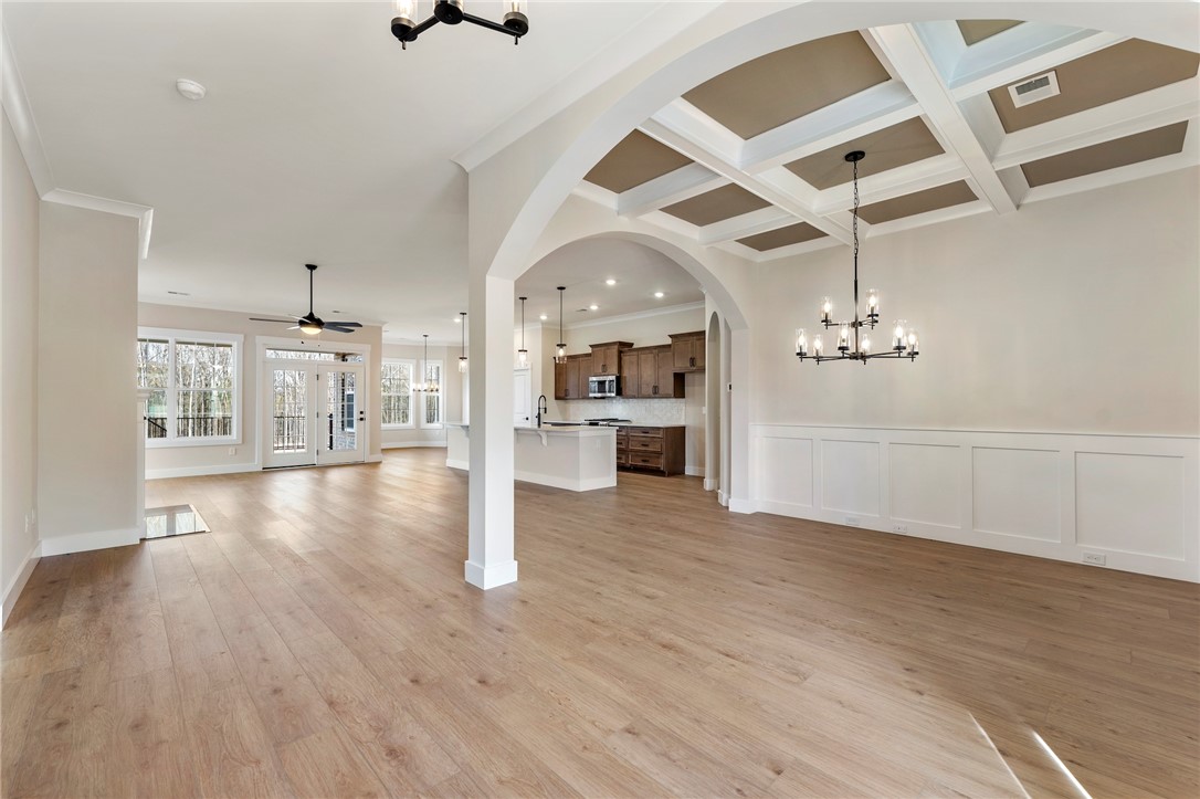 103 Wagner Court Easley, SC 29642 - Photo 5 of 36 This expansive open-concept living area features a sophisticated coffered ceiling and abundant natural light.