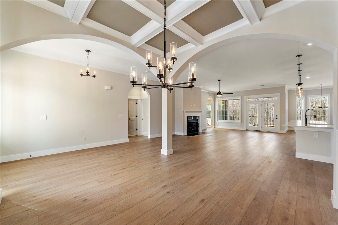 103 Wagner Court Easley, SC 29642 - Photo 36 of 36 This expansive open floorplan features elegant coffered ceilings and rich hardwood flooring throughout.