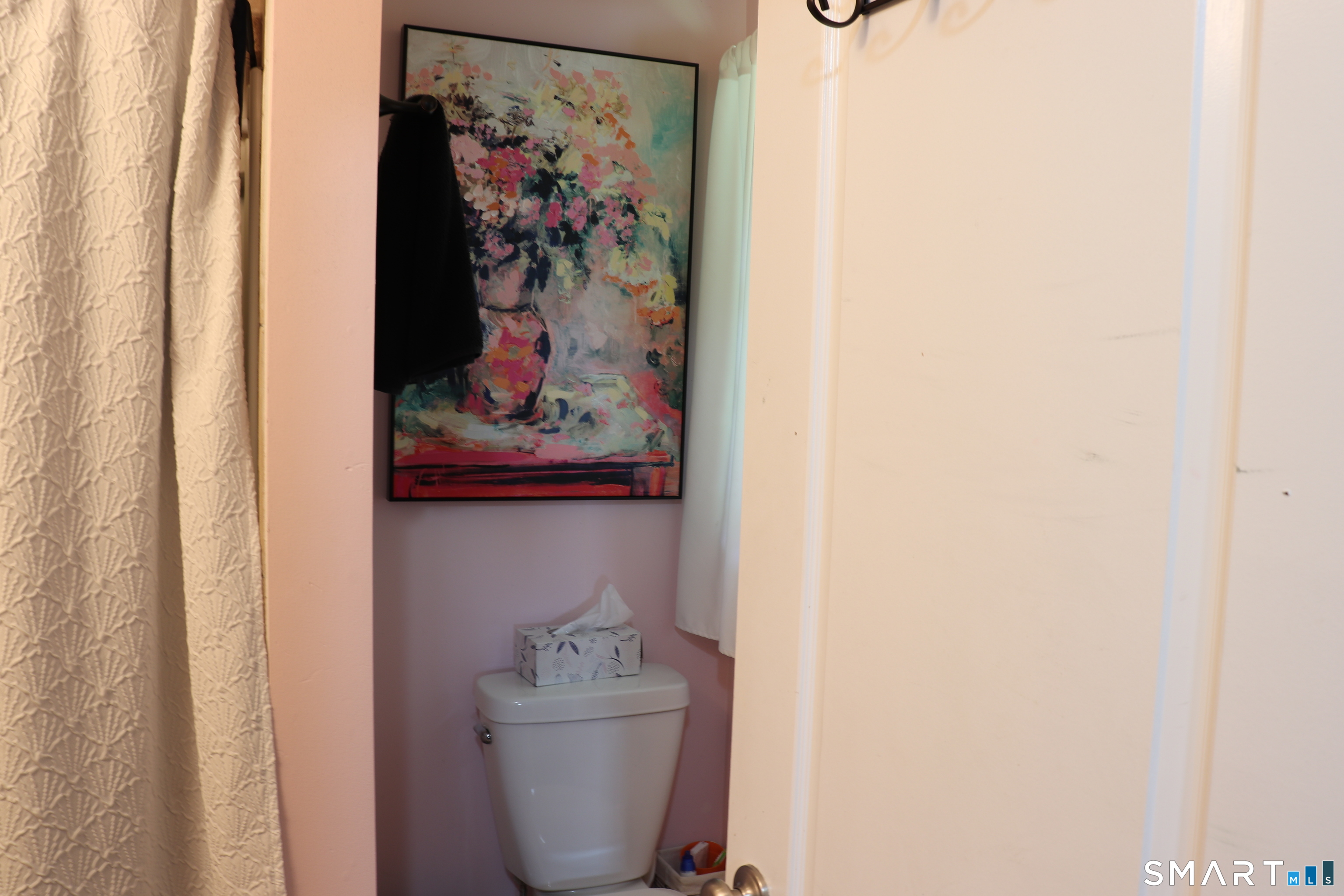308 Abbe Road Enfield, CT 06082 - Photo 26 of 33 a bathroom with a toilet and a shower curtain