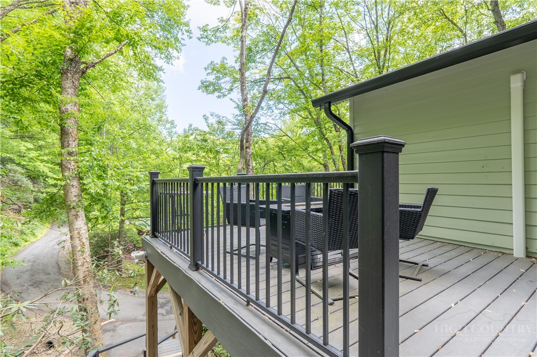 141 Snowflake Road Banner Elk, NC 28604 - Photo 25 of 28 a view of a balcony with wooden floor and fence