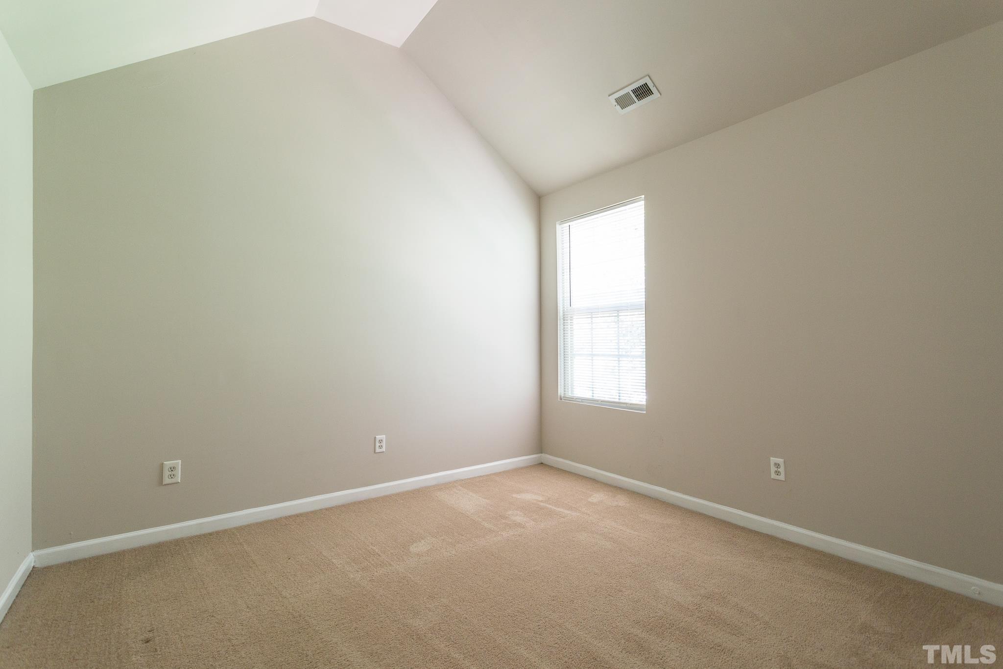 1004 Lombar Street Raleigh, NC 27610 - Photo 12 of 34 an empty room with a window