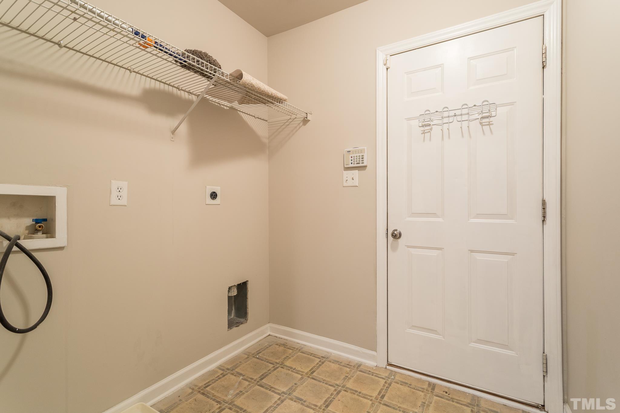 1004 Lombar Street Raleigh, NC 27610 - Photo 16 of 34 a view of a room with rack on the wall