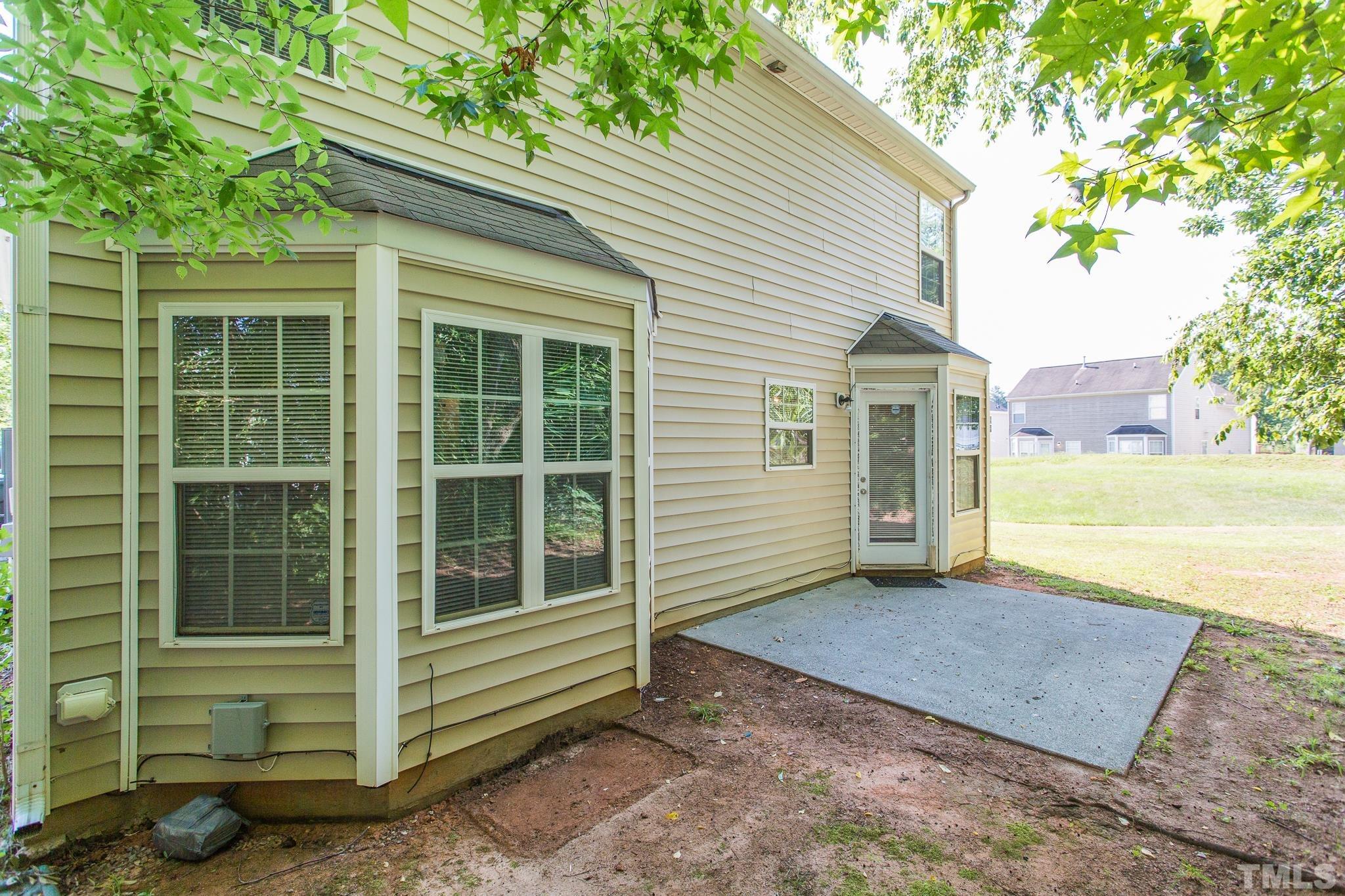 1004 Lombar Street Raleigh, NC 27610 - Photo 26 of 34 a view of a house with a yard