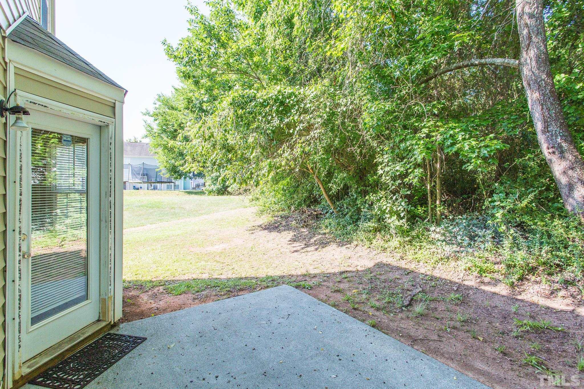 1004 Lombar Street Raleigh, NC 27610 - Photo 28 of 34 a view of a yard with an outdoor space
