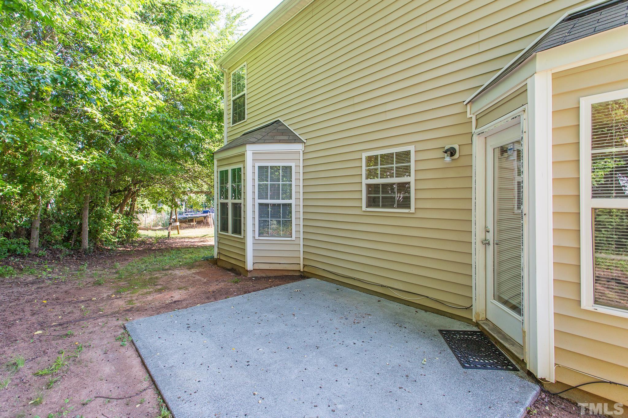 1004 Lombar Street Raleigh, NC 27610 - Photo 29 of 34 a view of a house with a backyard