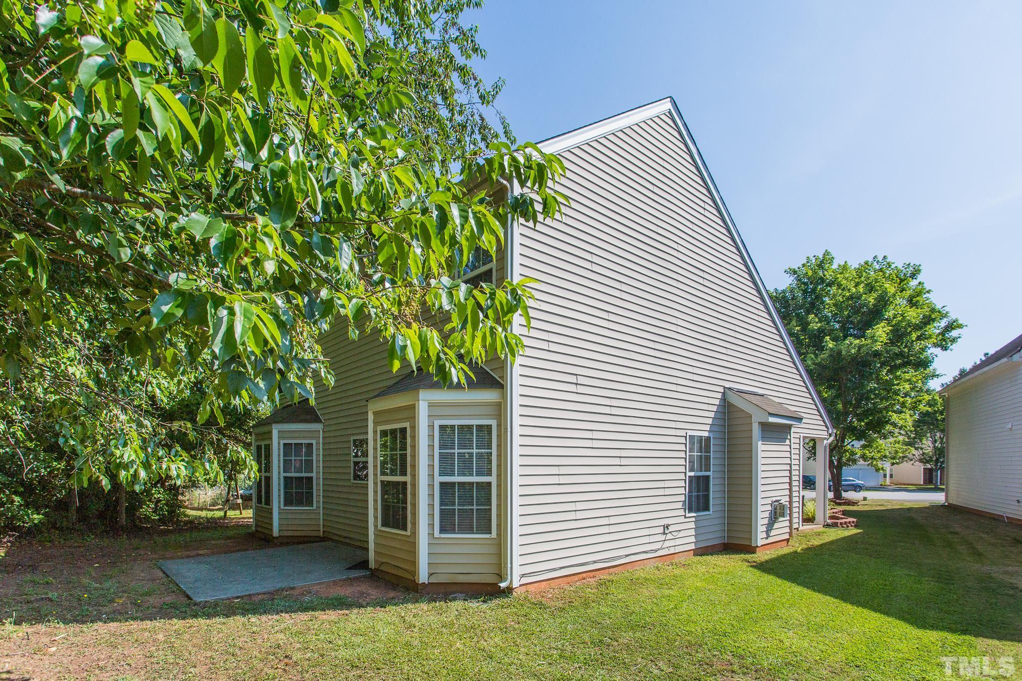 1004 Lombar Street Raleigh, NC 27610 - Photo 31 of 34 a front view of a house with a garden