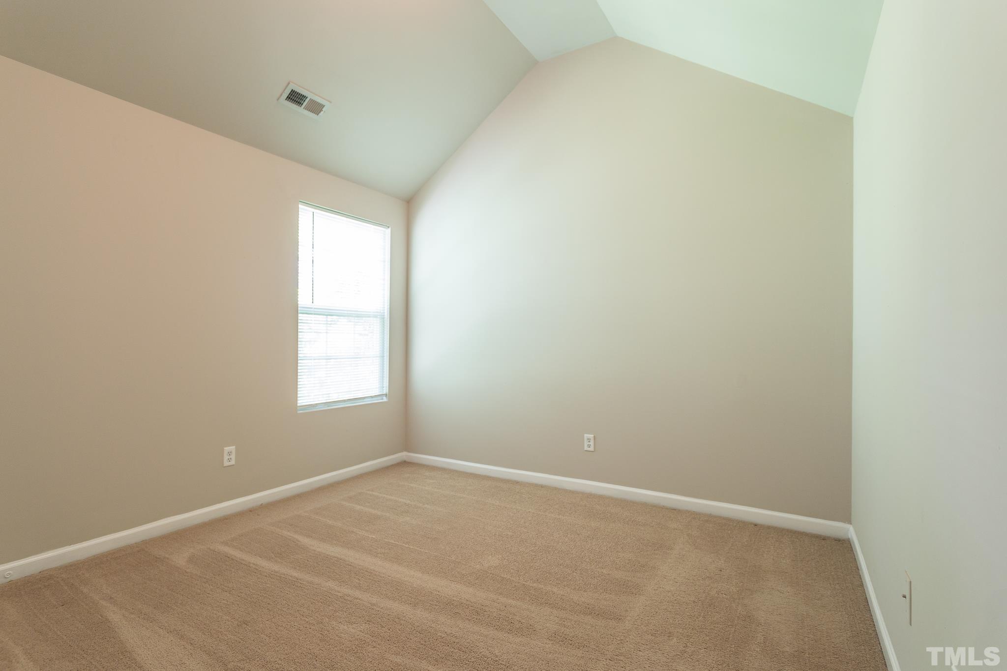 1004 Lombar Street Raleigh, NC 27610 - Photo 10 of 34 an empty room with a window