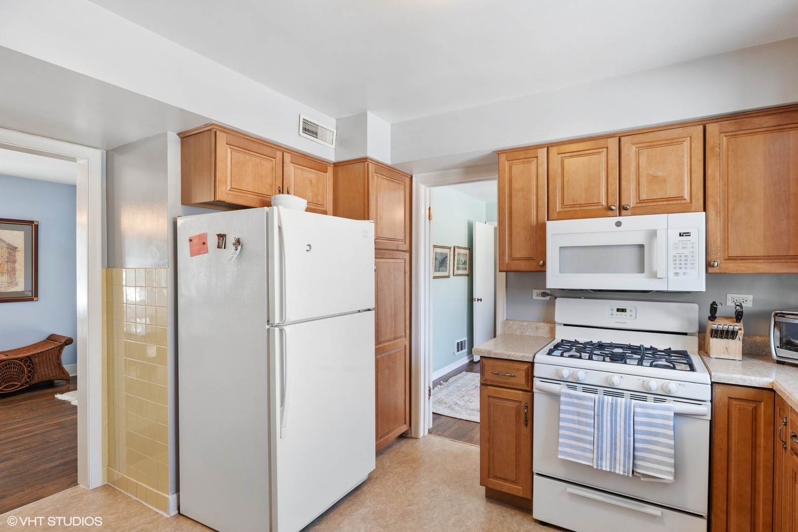 356 Herrick Road Riverside, IL 60546 - Photo 11 of 26 a kitchen with a refrigerator stove and cabinets