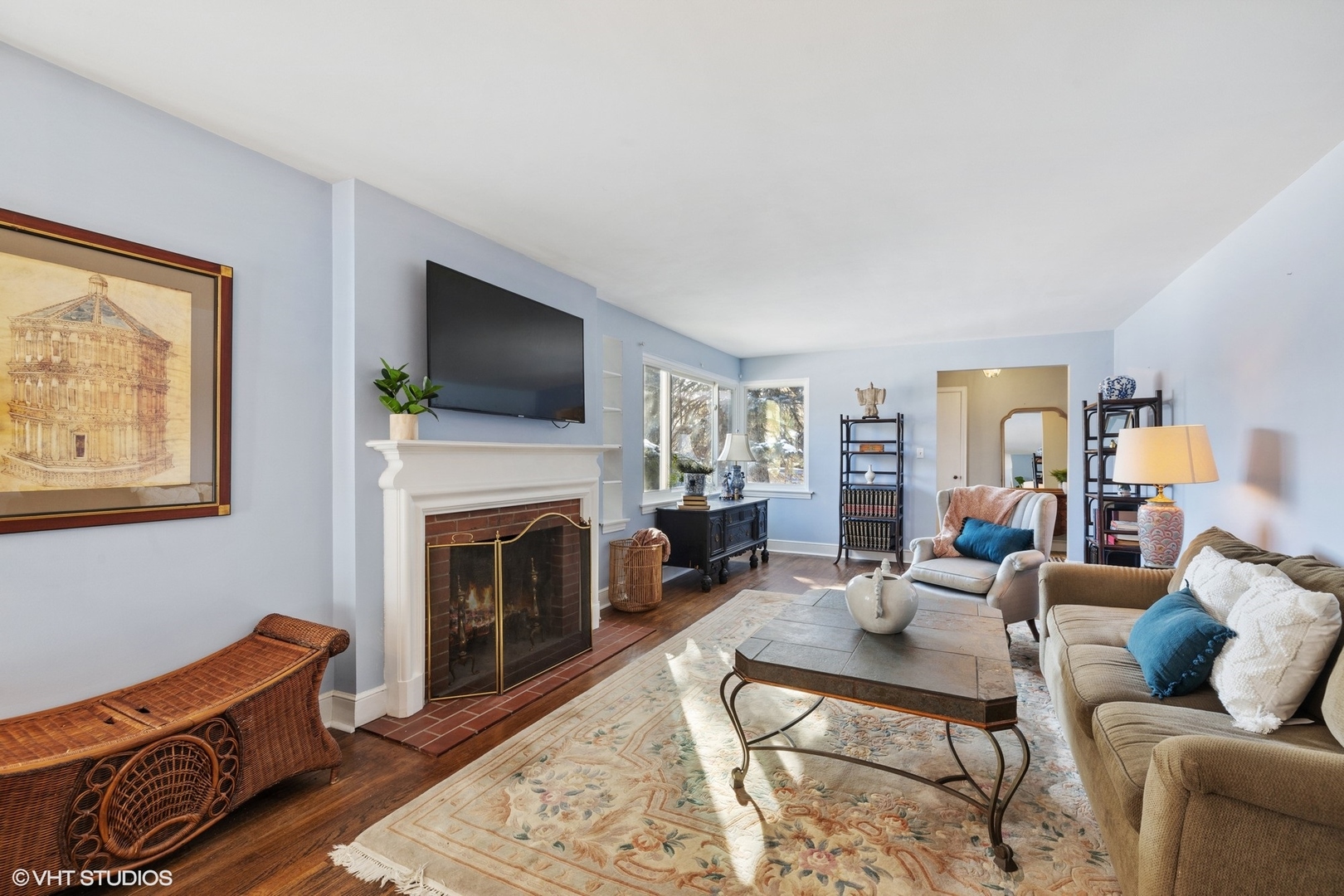 356 Herrick Road Riverside, IL 60546 - Photo 4 of 26 a living room with furniture a flat screen tv and a fireplace