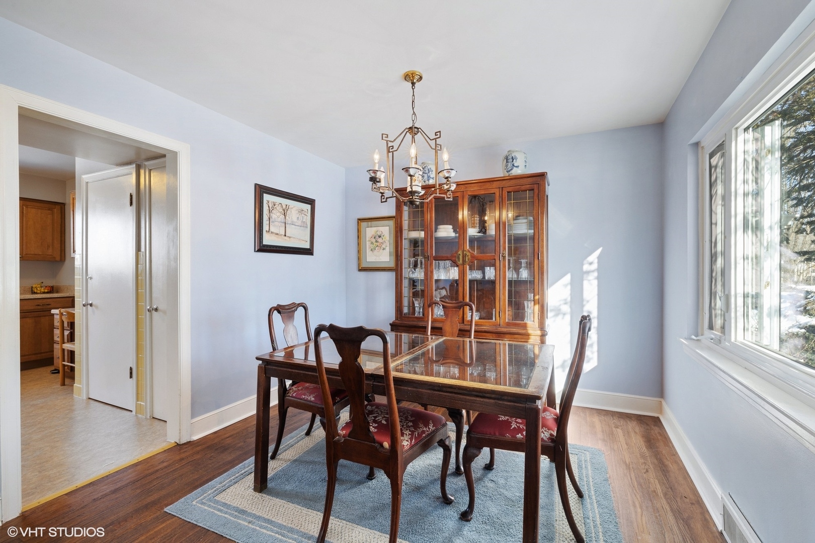 356 Herrick Road Riverside, IL 60546 - Photo 8 of 26 a view of a dining room with furniture window and wooden floor