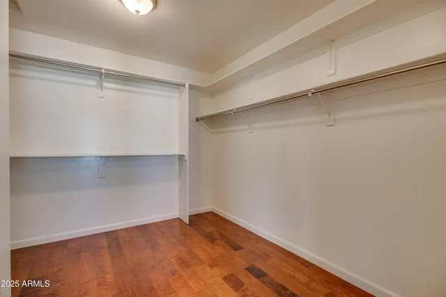 a view of an empty walk in closet