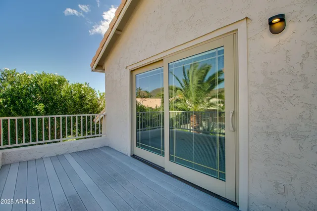a view of a door and wooden floor