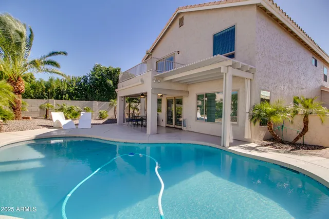 a view of a swimming pool with a patio