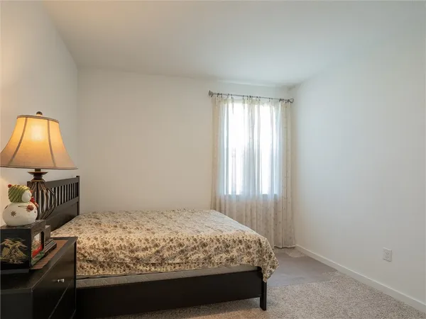 a bathroom with a sink mirror and vanity