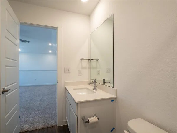 a bathroom with a toilet and a tub