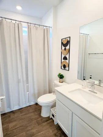 a bedroom with furniture and a window