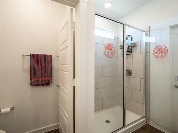 a bathroom with a shower and a shower